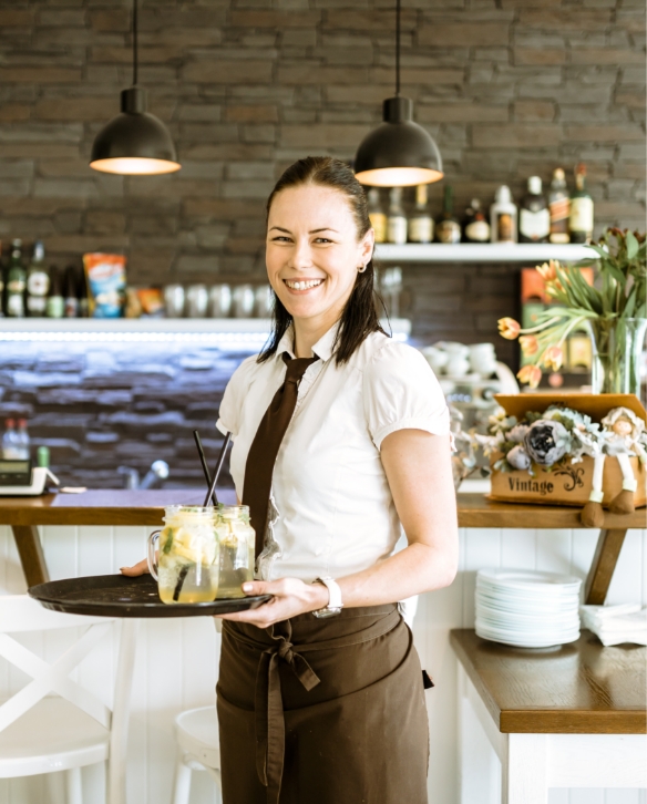 smiling waitress with cocktail